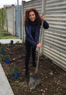 Tatiana planting flowers for Earth Day in Ossana