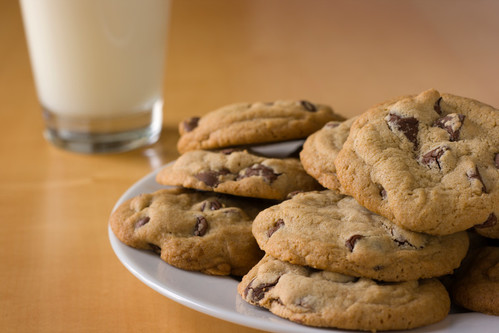 Plate of cookies with milk in the background