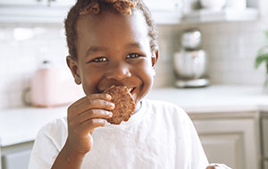Child eating reduced sugar snack