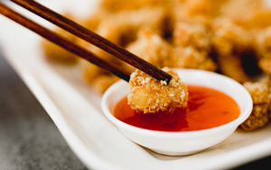 Crunchy chicken dipped in sauce