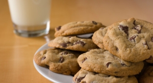 Plate of cookies with milk in the background