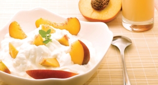 Bowl of yoghurt with peaches