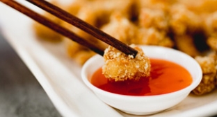 Crunchy chicken dipped in sauce