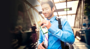 Man with healthy protein bar on the go