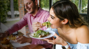 Woman eating crunchy healthy salad
